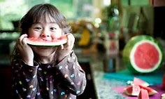 Emergency Food Assistance Program (TEFAP) - SMTCCAC - Little girl eating fruit Photo