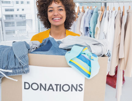 Lady with boxes donating clothes photo