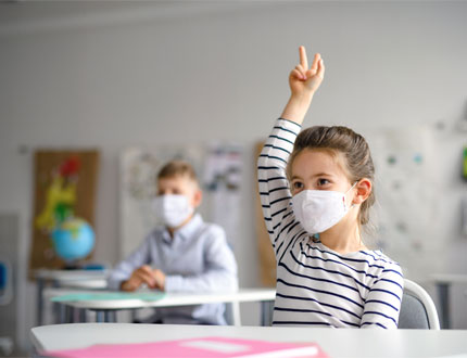 SMTCCAC - Head Start Young Girl With Mask With Hand Raised Photo