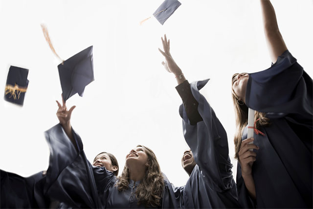  Students throwing their caps at graduation photo